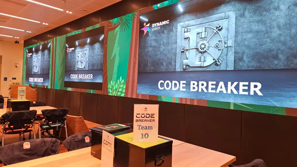 Setup of the Code Breaker challenge with puzzles and team materials ready.