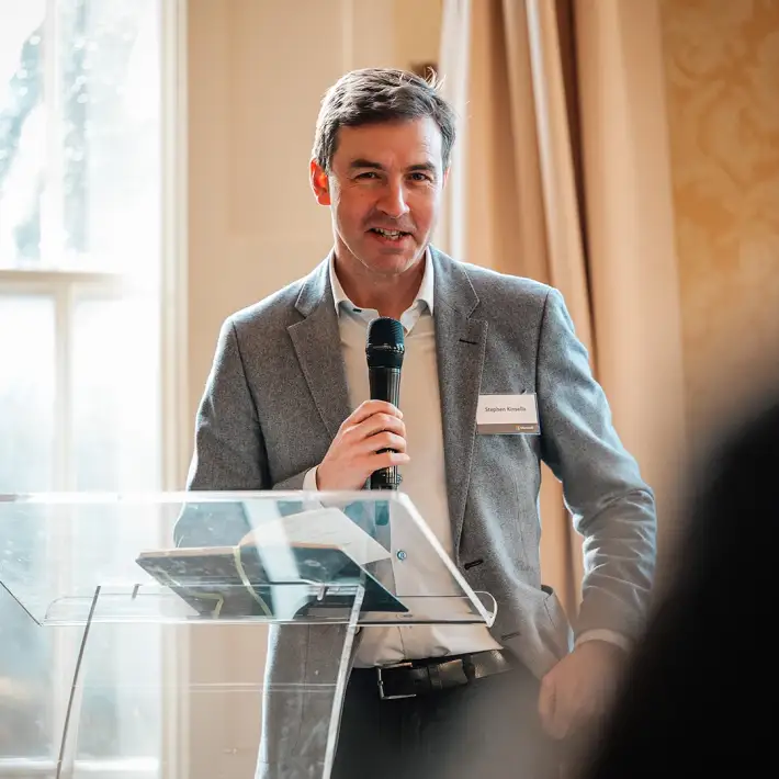 Keynote speaker presenting on stage at the Microsoft conference in Dublin