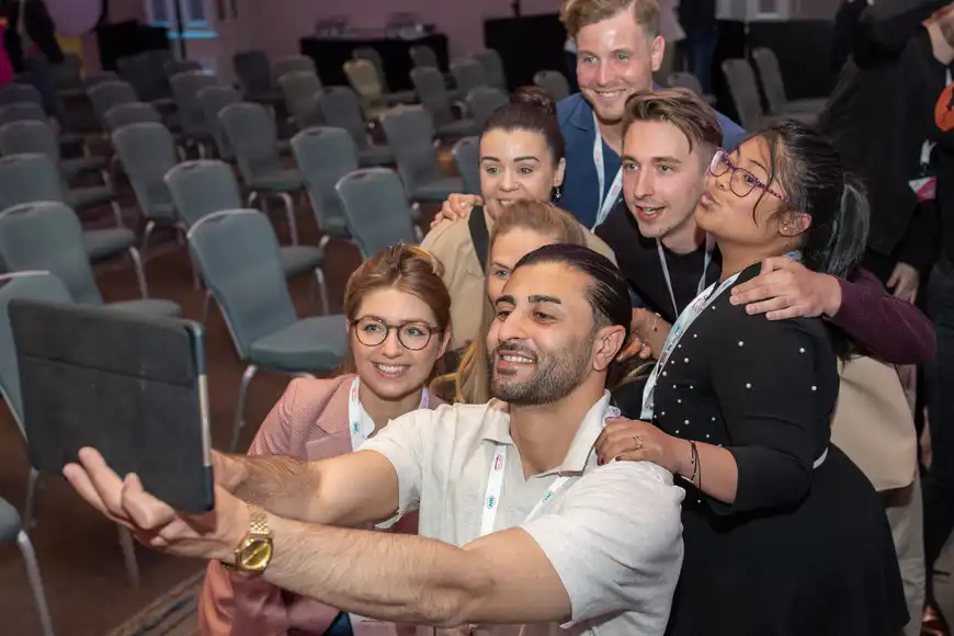 happy group doing digital ice breaker at corporate event