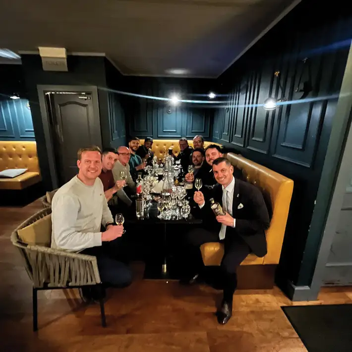 Senior leadership team enjoying group dinner during corporate offsite experience in Wicklow