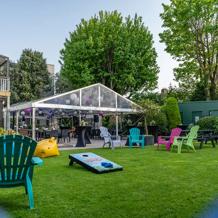 Spacious outdoor event space at The Sandymount Hotel with relaxed seating and a covered marquee, perfect for networking and corporate gatherings.