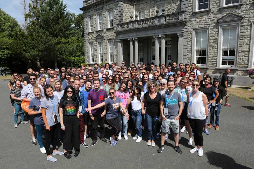 Large corporate group photo at a Shannon venue during a company team building event