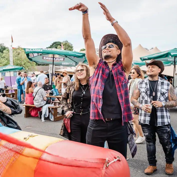 Team enjoying inflatable basketball at outdoor staff appreciation day