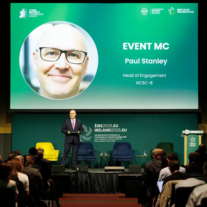 Event MC Paul Stanley addressing delegates on the main stage at the NCSC Cyber Security Conference in Dublin.