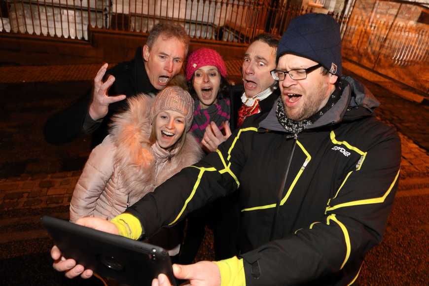 Corporate team solving Who Killed Molly mystery challenge during a problem solving team building event in Ireland