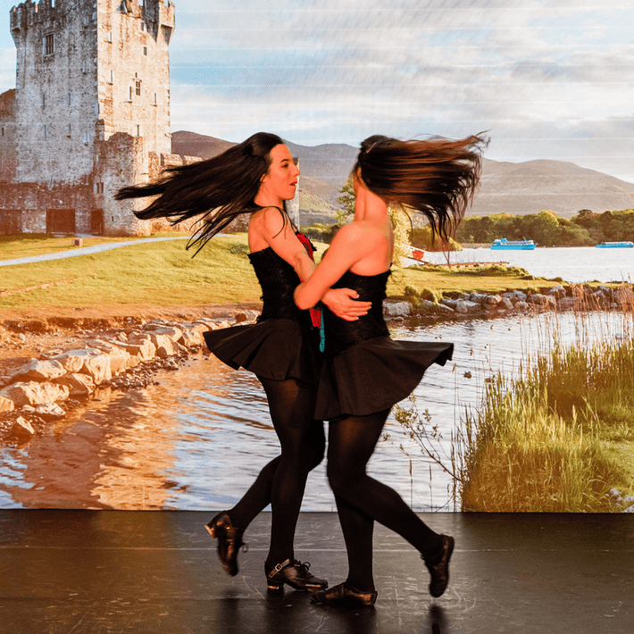 Two girls dancing on stage 