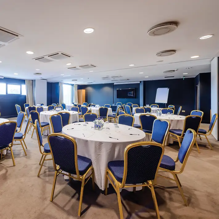 Conference room with round table setup at Shearwater Hotel Ballinasloe ideal for team building workshops and group sessions