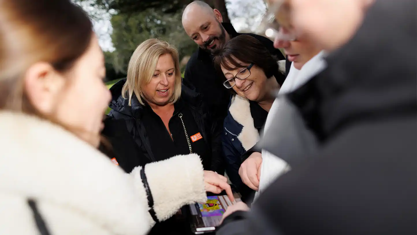 Corporate team completing The Ultimate GPS team building challenge on an iPad