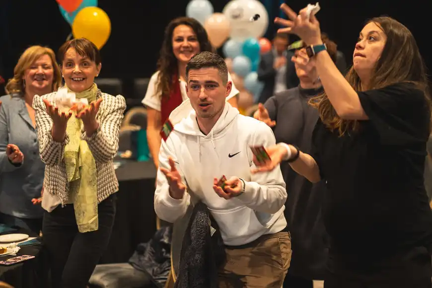 corporate group playing some team building onboarding games