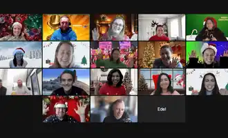 Remote team enjoying a virtual Christmas party on Zoom with festive backgrounds, Santa hats, and holiday decorations