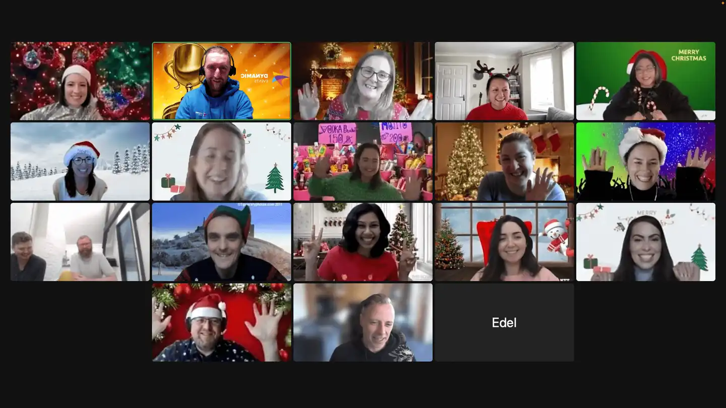 Remote team enjoying a virtual Christmas party on Zoom with festive backgrounds, Santa hats, and holiday decorations