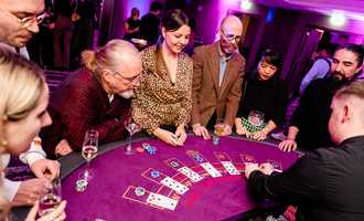 people playing at casino table