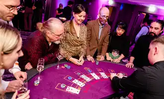 Corporate casino team building night in Dublin with colleagues playing blackjack at professional tables