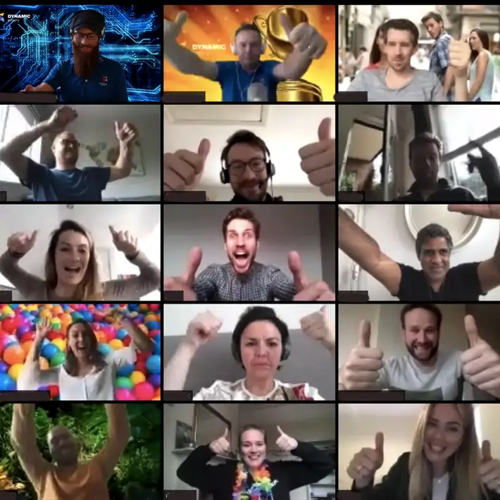Employees taking part in an online team building event during a Virtual Away Day video call, celebrating together with thumbs up.