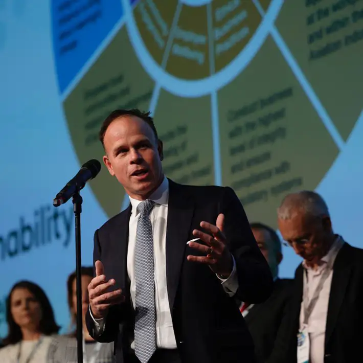 man speaking at conference