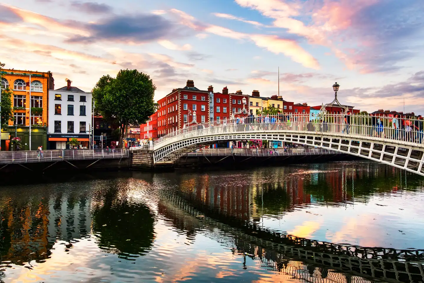 Picture of Ha'Penny Bridge with multi coloured buildings behind the bridge