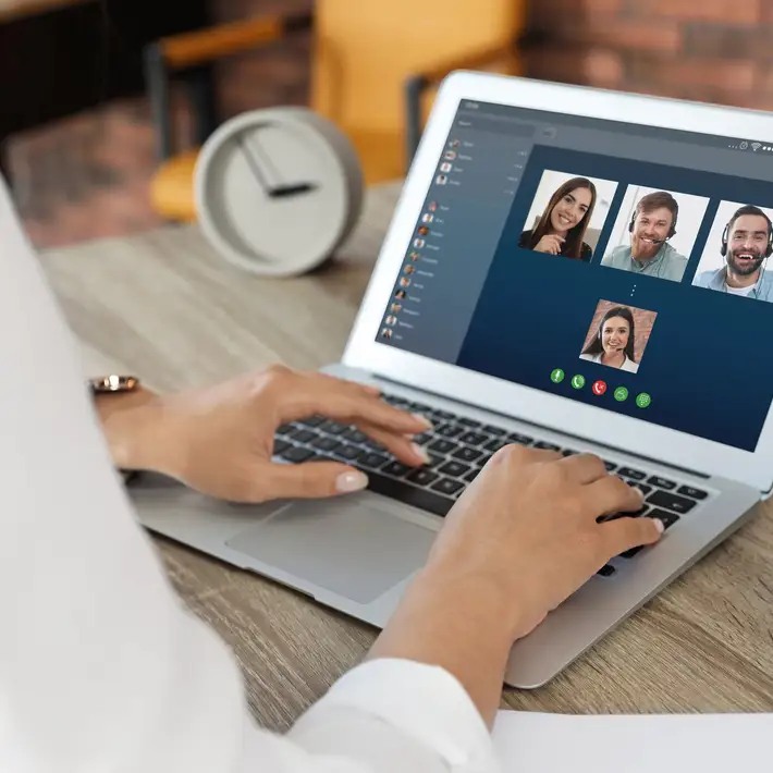 Woman on video call with team mates