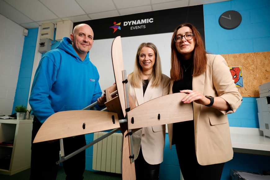 Corporate team building a wooden wind turbine during a Dynamic Events employee engagement activity in Ireland
