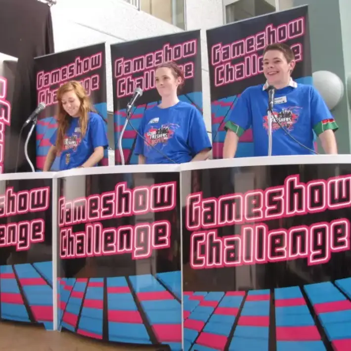 Participants using wireless keypads during a corporate gameshow night