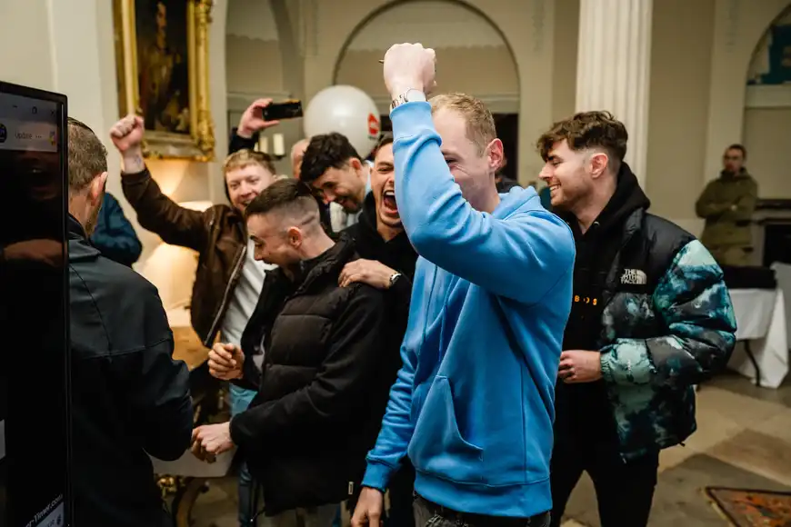 corporate team celebrating during indoor winter team building event