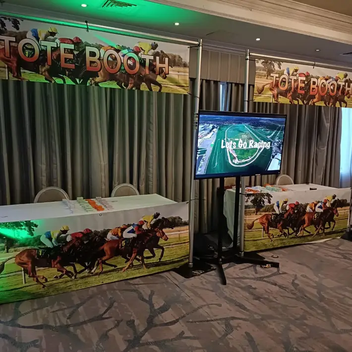  Guests watching horse races and enjoying a structured team night