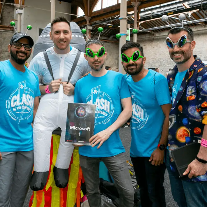 Participants unlocking clues on a mobile app during a Halloween corporate event.