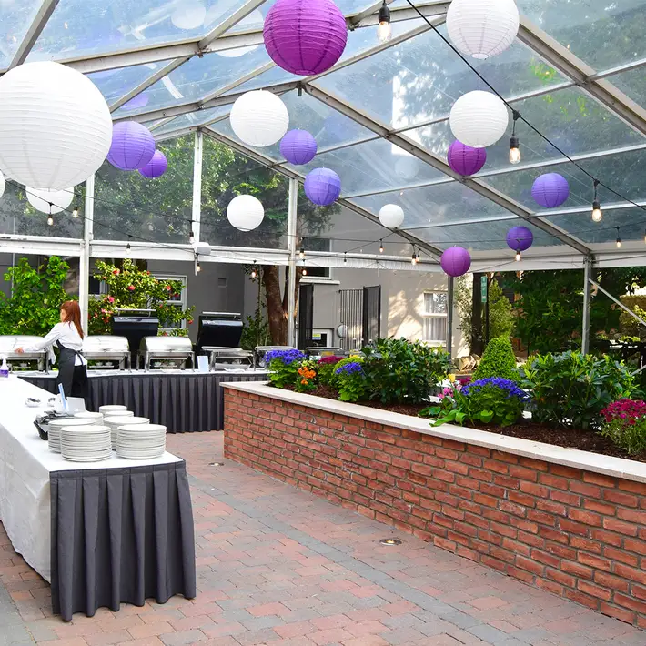 Stylish outdoor event setup at The Sandymount Hotel with a covered BBQ area, ideal for corporate summer parties and team-building days.