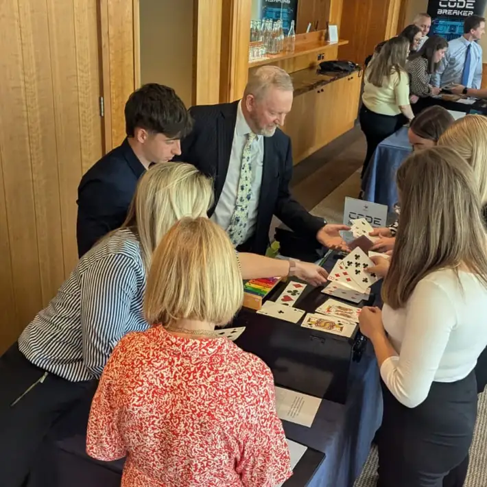 People looking for cards in a code breaker task