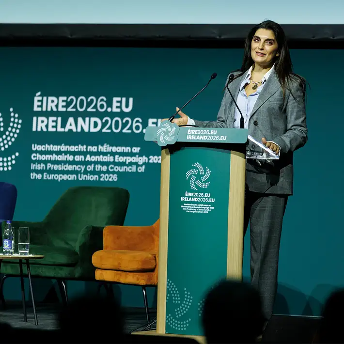 Female speaker delivering a presentation at the podium on the main stage of the NCSC Cyber Security Conference in Dublin.
