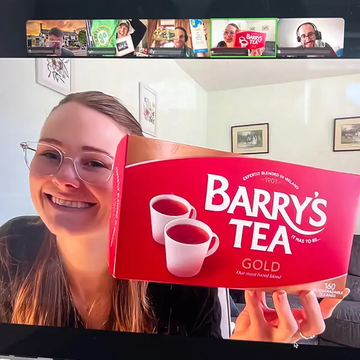 Happy team doing st patricks day team building quiz for corporates