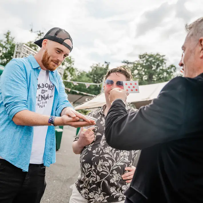 Magicians performing on stage at Covalen’s summer staff event