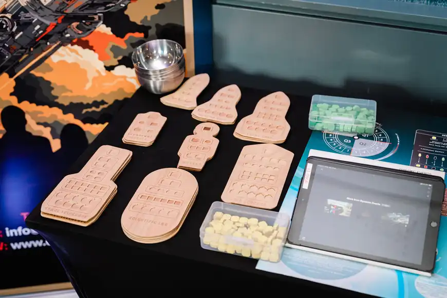 Before Mars set up with wooden rockets and coloured puzzle pieces with an ipad and branding | Team Training Cork