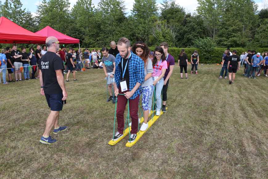 Outdoor team building relay game in Shannon with colleagues working together