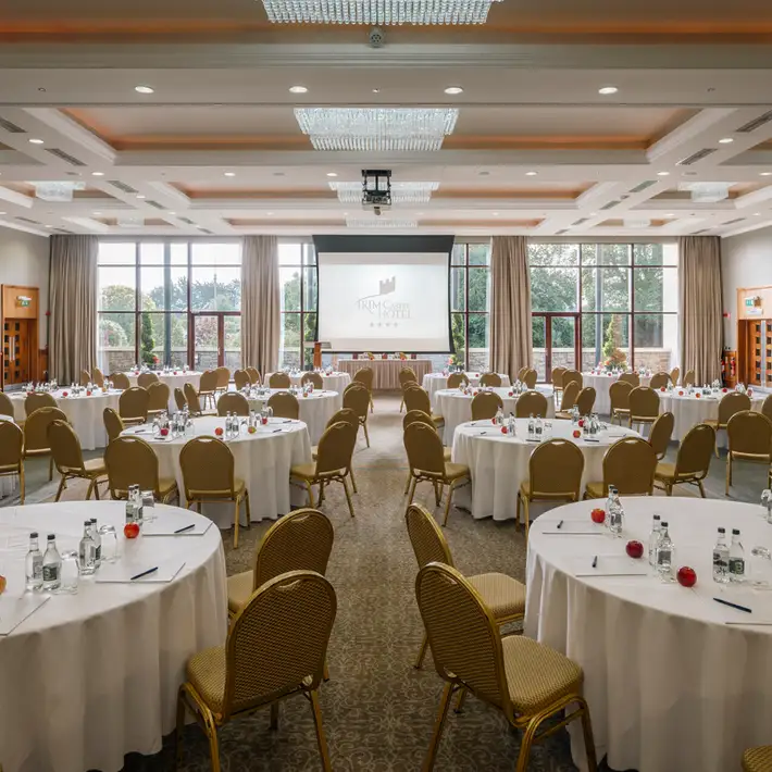 Conference room at Trim Castle Hotel set up with round tables for a corporate event