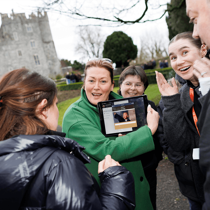 people looking at ipad on scavenger hut event