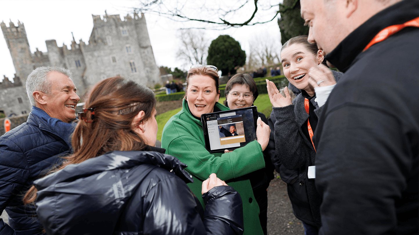 people looking at ipad on scavenger hut event