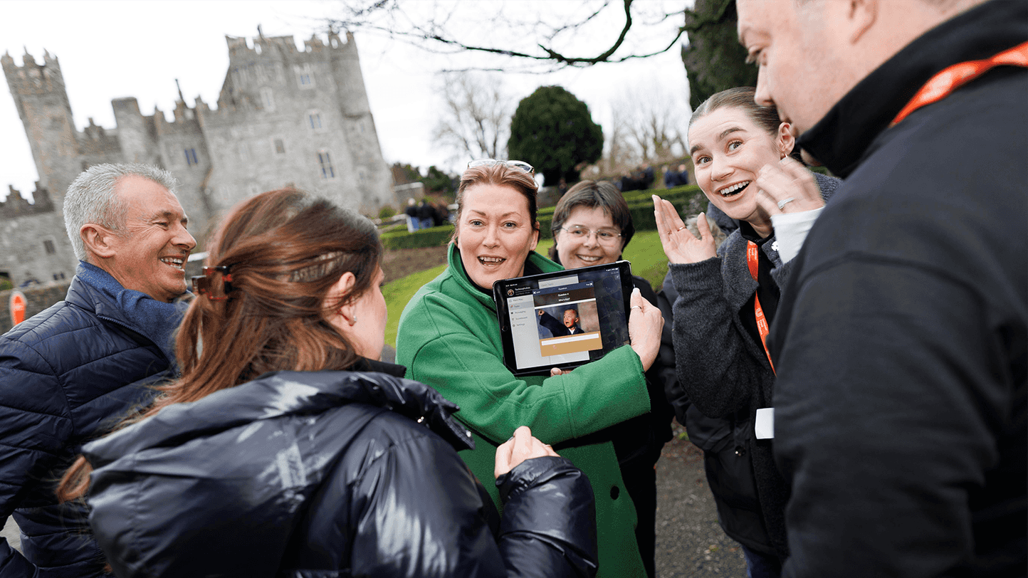 people looking at ipad on scavenger hut event